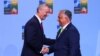 NATO Secretary-General Jens Stoltenberg (left) shakes hands with Hungarian Prime Minister Viktor Orban ahead of a NATO leaders summit in Vilnius in July 2023.

