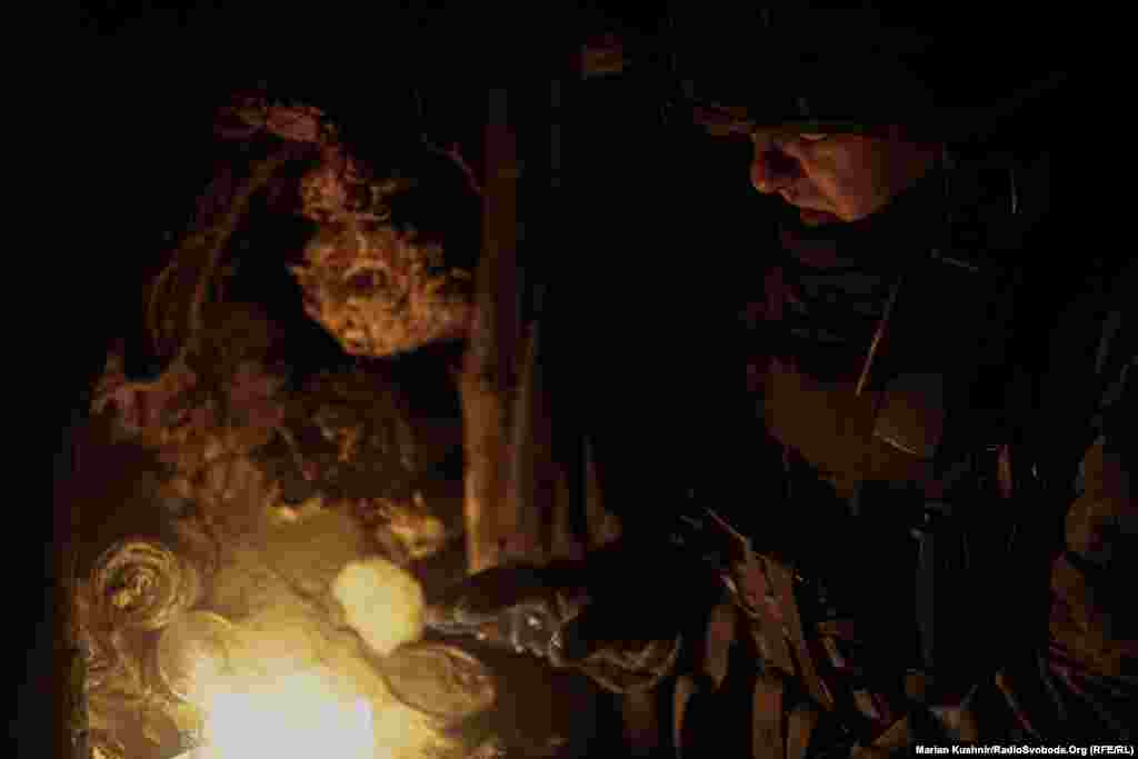 ...that keeps the men from being completely absorbed into the pitch-black darkness.
