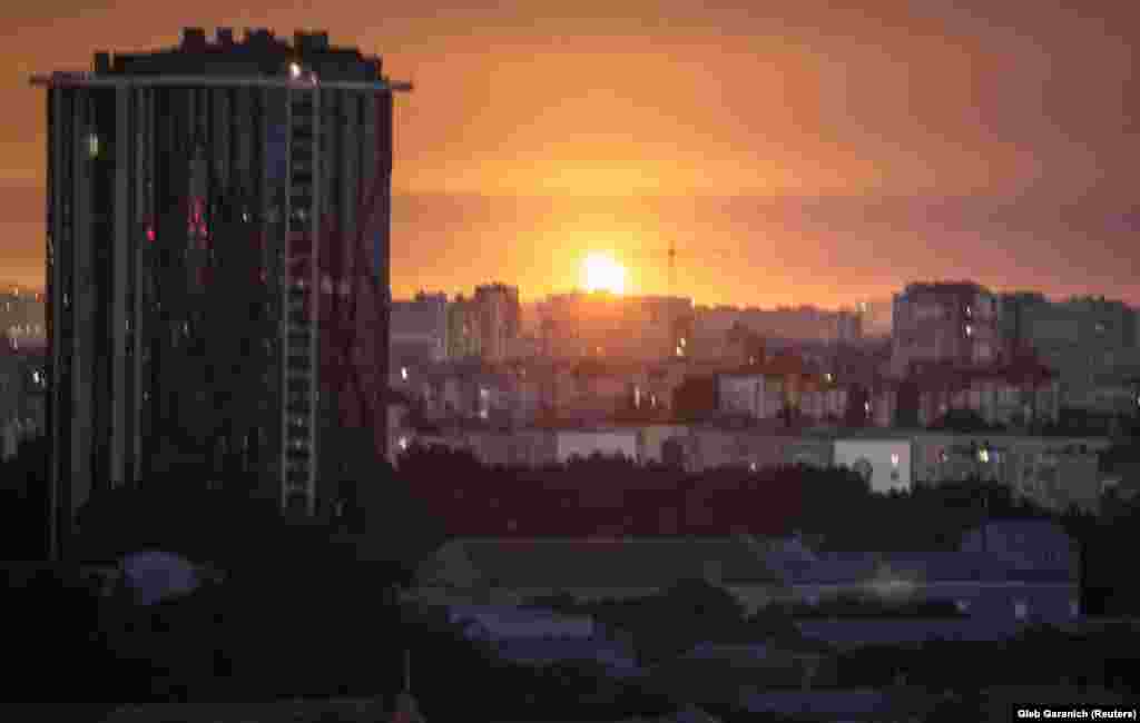An explosion is seen in the sky above Kyiv during a Russian missile strike on September 21. Russian missiles pounded cities across Ukraine, killing at least two people and trapping others under rubble. The early morning missile attack was Russia’s largest in over a month.