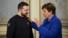 Ukrainian President Volodymyr Zelenskiy (left) and IMF chief Kristalina Georgieva talk in Kyiv on February 20. 