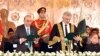 Supreme Court Chief Justice Qazi Faez Isa (front right) administers an oath to newly sworn-in Pakistani President Asif Ali Zardari (front left) at the President House in Islamabad on March 10.