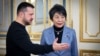 Ukrainian President Volodymyr Zelenskiy (left) greets Japanese Foreign Minister Yoko Kamikawa in Kyiv on January 7.