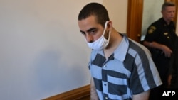 Hadi Matar, the man accused in the attempted murder of British author Salman Rushdie, leaves court after a procedural hearing at Chautauqua County Courthouse in Mayville, New York, on August 18.