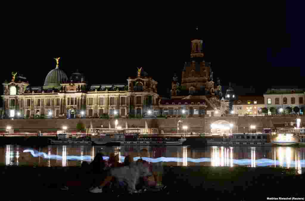 This is how the famed riverside of Dresden looked on the evening of August 22. Bright lights usually showcase the eastern German city's architecture, but in recent weeks the skyline has gone dark. 