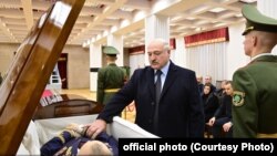 Alyaksandr Lukashenka pays his respects at Uladzimir Makey's funeral in Minsk on November 29.