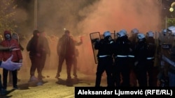 Protesters and police clash in the Montenegrin capital, Podgorica, on December 12. 