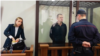 Andrzej Poczobut (center) attends a court hearing last month. 