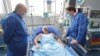 Bulgarian Foreign Minister Nikolay Milkov (left) and North Macedonia's foreign minister, Bujar Osmani, visited Hristijan Pendikov in the hospital on January 22 after he was attacked and beaten over the weekend in Ohrid, North Macedonia.