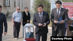 People attend the funeral of wildlife ranger Qanysh Nurtazinov, who was killed in July 2019.