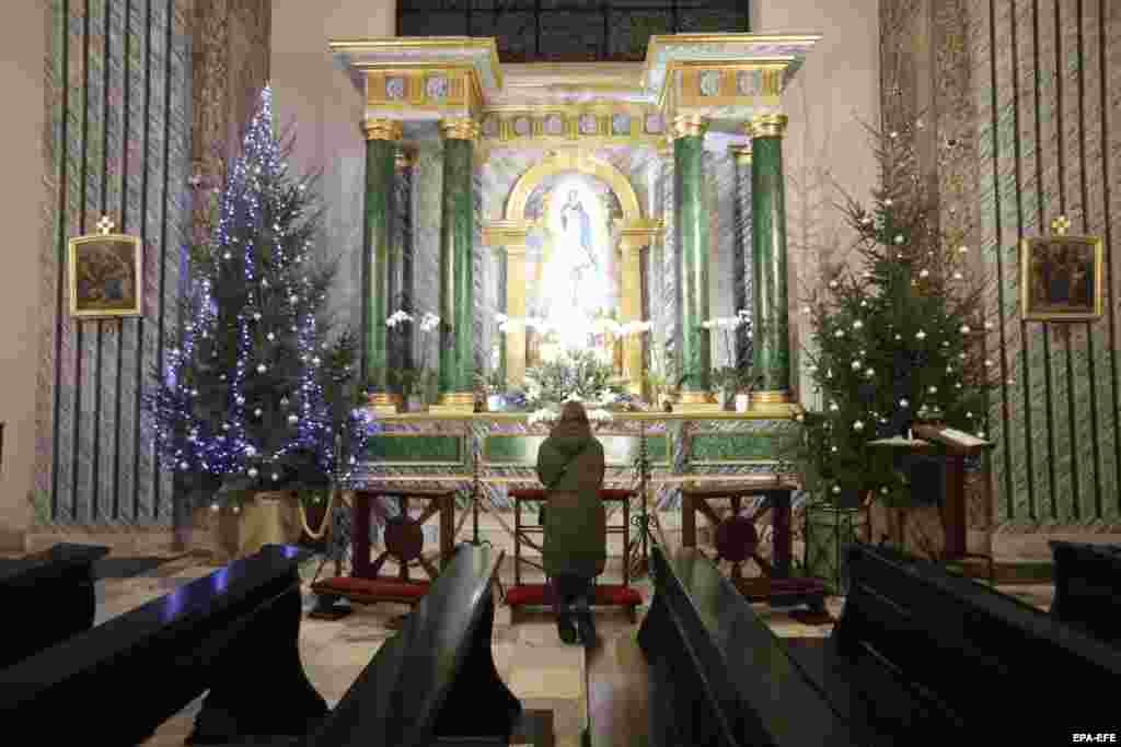 A woman during a "day of prayer" for peace in the St. Alexander Roman Catholic church in Kyiv on January 26. 