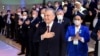 The amendments to the constitution will "nullify" the previous and current terms of Uzbek President Shavkat Mirziyoev (center), allowing him to run for another two consecutive terms. (file photo)