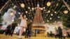 Holiday shoppers take a selfie in front of St. Sophia's Cathedral in Kyiv.