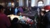 Mourners attend a funeral service for the slain family in the city of Gyumri on January 15.