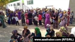 turkmenistan. mary. people are waiting in queue in front of a state grocery store to buy cooking oil