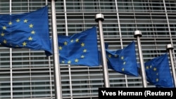 BELGIUM -- European Union flags fly outside the European Commission headquarters in Brussels, Belgium, March 6, 2019.