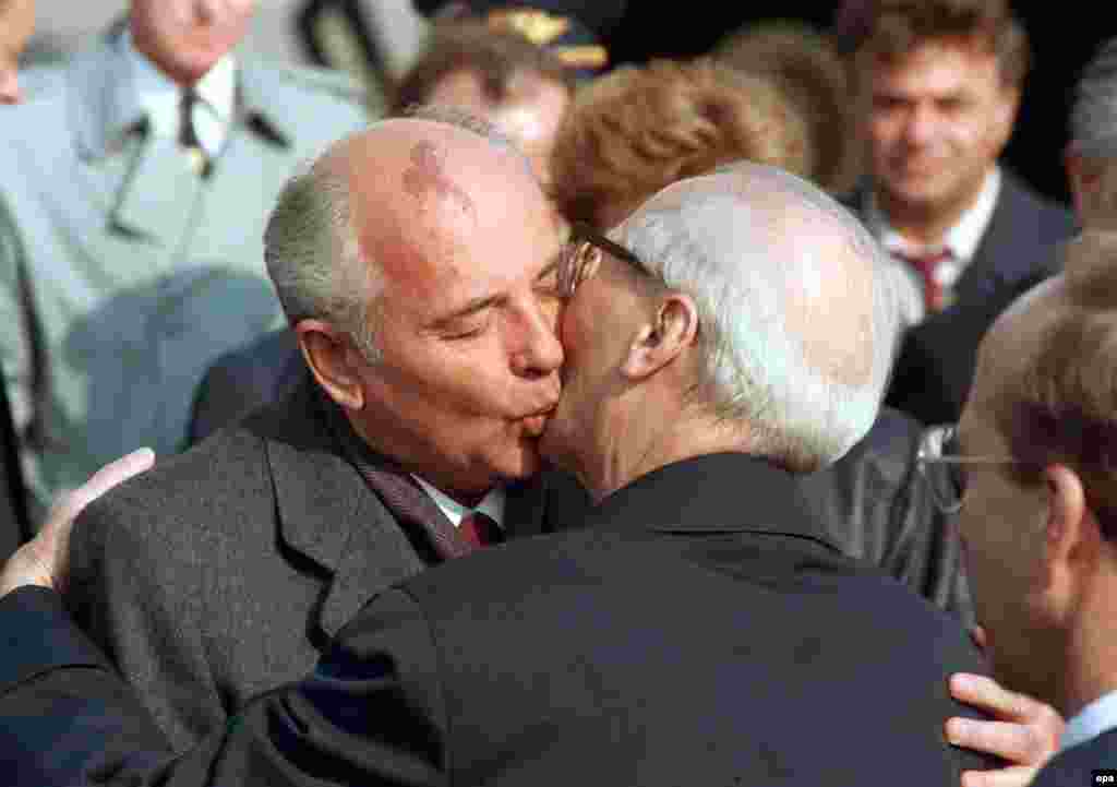 Gorbachev embraces East German leader Erich Honecker after arriving in East Berlin for ceremonies on October 6, 1989, marking the 40th anniversary of the founding of the German Democratic Republic. A month later, the Berlin Wall collapsed and East Germans flooded to the West.
