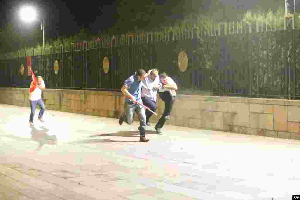 People run for cover. Above Ankara, sonic booms from low-flying military jets mixed with the sound of explosions. At 11 p.m. on July 15, Turkish broadcaster NTV reported that "Turkish fighter jet shoots down military helicopter used by coup plotters over Ankara."
