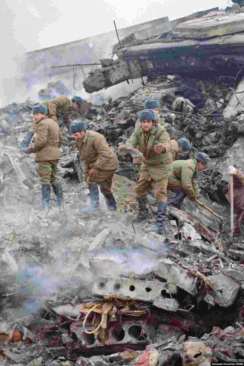 Soviet soldiers working to clear the piles of rubble. Gorbachev asked one interviewer, &quot;Who is to blame for the fact that in the concrete blocks there is too little cement but more than enough sand? This means the cement was stolen. By whom?&quot;