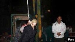 Convicted murderer Alireza Molla-Soltani is prepared for execution by public hanging on September 21.