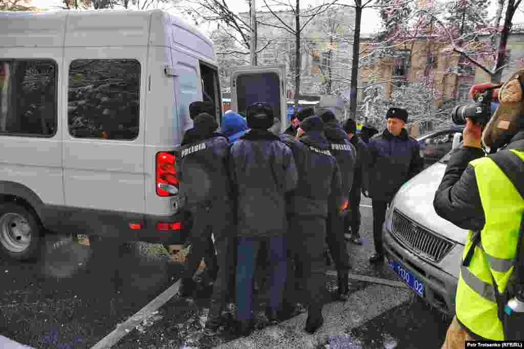 Police forced a demonstrator into a van in Almaty. Around the same time, more than 50 people were arrested in the capital, Nur-Sultan. 