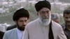 Mojtaba Khamenei (left) walks behind his father, Supreme Leader Ayatollah Ali Khamenei. (file photo)