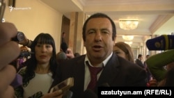 Armenia - Businessman Gagik Tsarukian, accompanied by Naira Zohrabian (L), speaks to reporters in the parliament in Yerevan,18May2017 