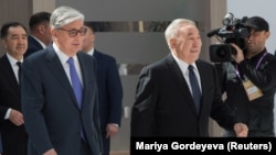 Kazakh President Qasym-Zhomart Toqaev (left) and former President Nursultan Nazarbaev at the Astana Economic Forum in Nur-Sultan on May 16, 2019.
