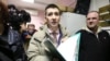 Yoga teacher Dmitry Ugay (center) appears in court in St. Petersburg on January 9.