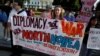 Russia -- Protesters call for peaceful negotiations with North Korea during a vigil in front of the White House in Washington, U.S., August 9, 2017