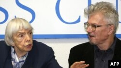 Activists Lyudmila Alekseyeva (left) and Eduard Limonov, at a press conference in Moscow in January, have split over Moscow officials' demands.