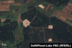 A Planet Labs satellite image from August 31 shows four separate construction areas at the site near Paulauka, Belarus, 60 kilometers south of Minsk, linked by roads.