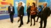 Президент «Гражданского альянса Казахстана» Нурлан Еримбетов (слева) показывает выставку достижений НПО Казахстана министрам и депутатам парламента. Астана, 25 ноября 2016 года.