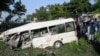 Residents gather around the wreckage of a van alongside a railway track following the fatal accident in Punjab Province on July 3. 