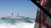 Britain Freezes Talks With Iran