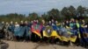 Ukrainian prisoners released in a swap with Russia pose for a photo on September 13.