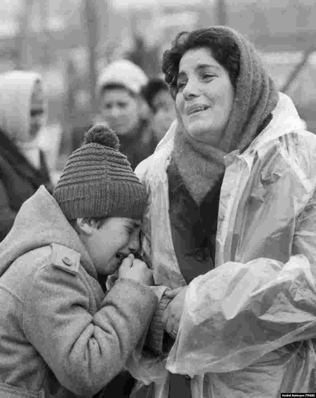 Grieving locals near their destroyed house. Gorbachev declared, &quot;In my entire life, I&#39;ve never seen one-thousandth of the suffering I&#39;ve seen here.&rdquo;