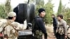 Сирияда согушуп жүргөн борбор азиялыктарга түспөлдөш адамдар.