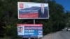 Billboards near Sevastopol tout party slogans for upcoming Russian parliamentary elections on the annexed Ukrainian peninsula of Crimea. Kyiv has denounced the poll on the territory as illegitimate. 