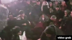 A video recording by a witness shows a group of mostly young men throwing punches at each other, and grabbing and pulling each other’s jackets. 