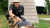 Former Ukrainian solder Vasyl Velychko pets Ira, one of his many wards at a dog shelter in Lviv, western Ukraine.