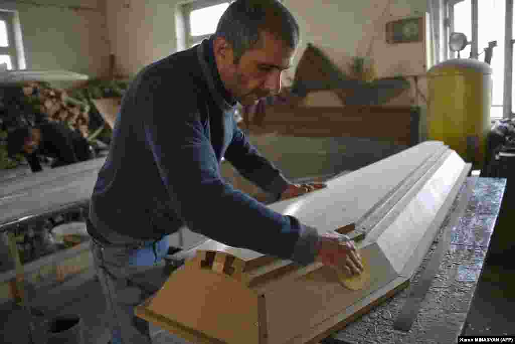 A man makes a coffin at a furniture workshop in Stepanakert on November 4. The company switched its business to casket production amid the ongoing military conflict between Armenia and Azerbaijan in Nagorno-Karabakh. 