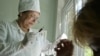 A doctor takes a blood test at the regional medical AIDS center in the southern Russian city of Rostov on Don. 