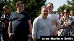 Andrey Dzmitryeu (front right), a former candidate in the 2020 Belarusian presidential election, is pictured outside a pre-trial detention facility in Zhodzina, Belarus, in September 2020.