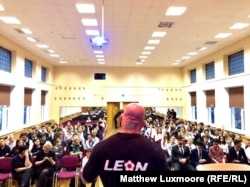 Monson addresses people who lost their money in a housing estate in Balashikha, a suburb of Moscow,