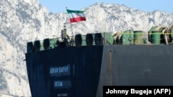 An Iranian flag flutters on board the Adrian Darya oil tanker, formerly known as Grace 1, off the coast of Gibraltar on August 18.