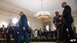 U.S. President Donald Trump leaves the stage after participating in a trilateral signing with Azerbaijani President Ilham Aliyev and Armenian Prime Minister Nikol Pashinian at the White House, August 8, 2025.