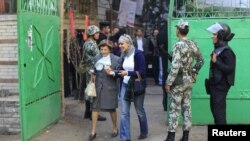 Voters at a polling station to cast ballots during the parliamentary elections in Cairo on November 29.