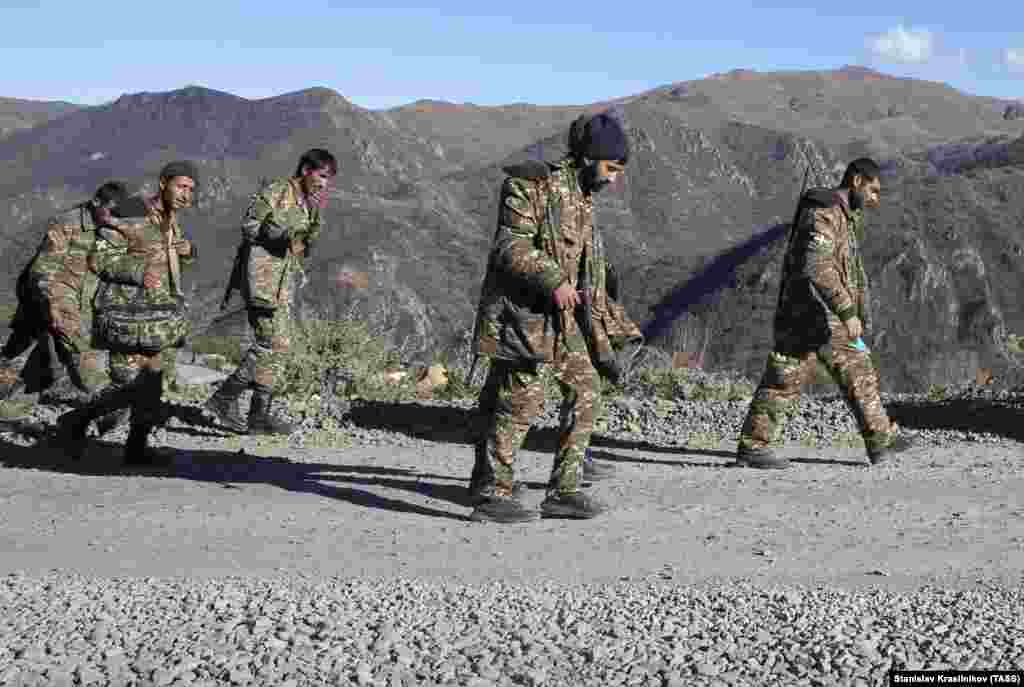 Armenian servicemen in Nagorno-Karabakh walk near the Armenian border on November 8. 