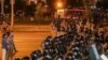 Protesters poured into the streets after the balloting ended, many of them facing off against riot police. 