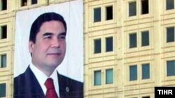 A portrait of Turkmen President Gurbanguly Berdymukhammedov hangs from the side of a building in the capital, Ashgabat, ahead of parliamentary elections.